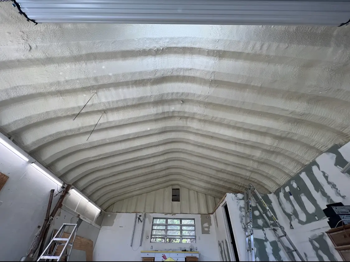 Spray polyurethane foam applied to the underside of a metal roof deck in Souderton